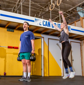 People exercising in a gym in Baltimore as a sober-friendly fitness activity